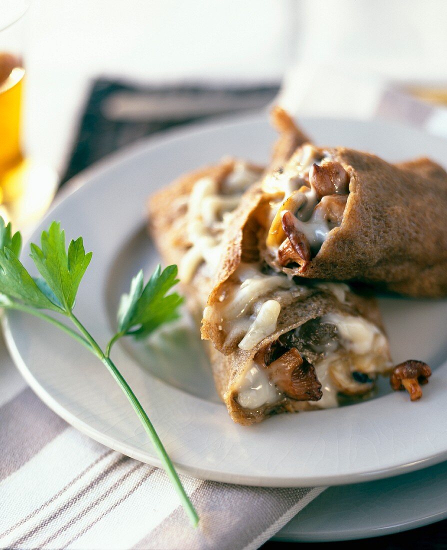Rolled buckwheat pancake with mushrooms and Comté