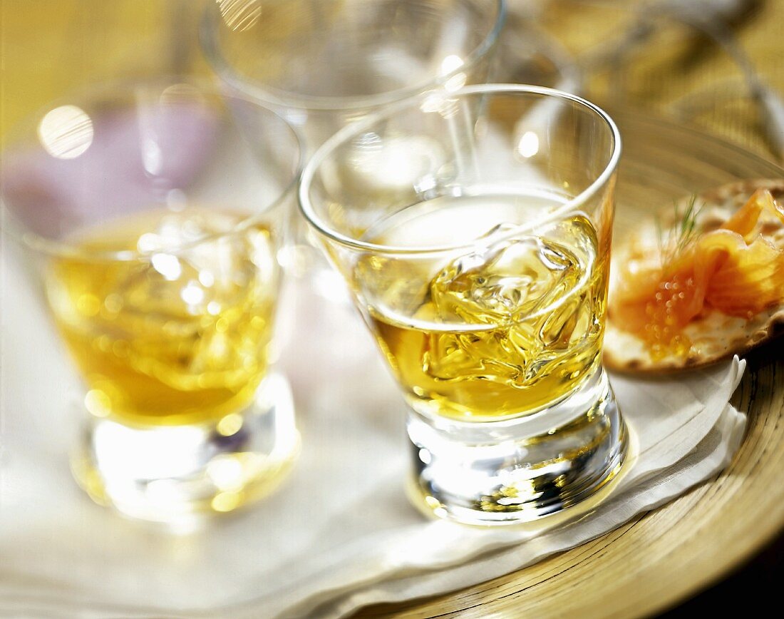 Glasses of whisky with ice