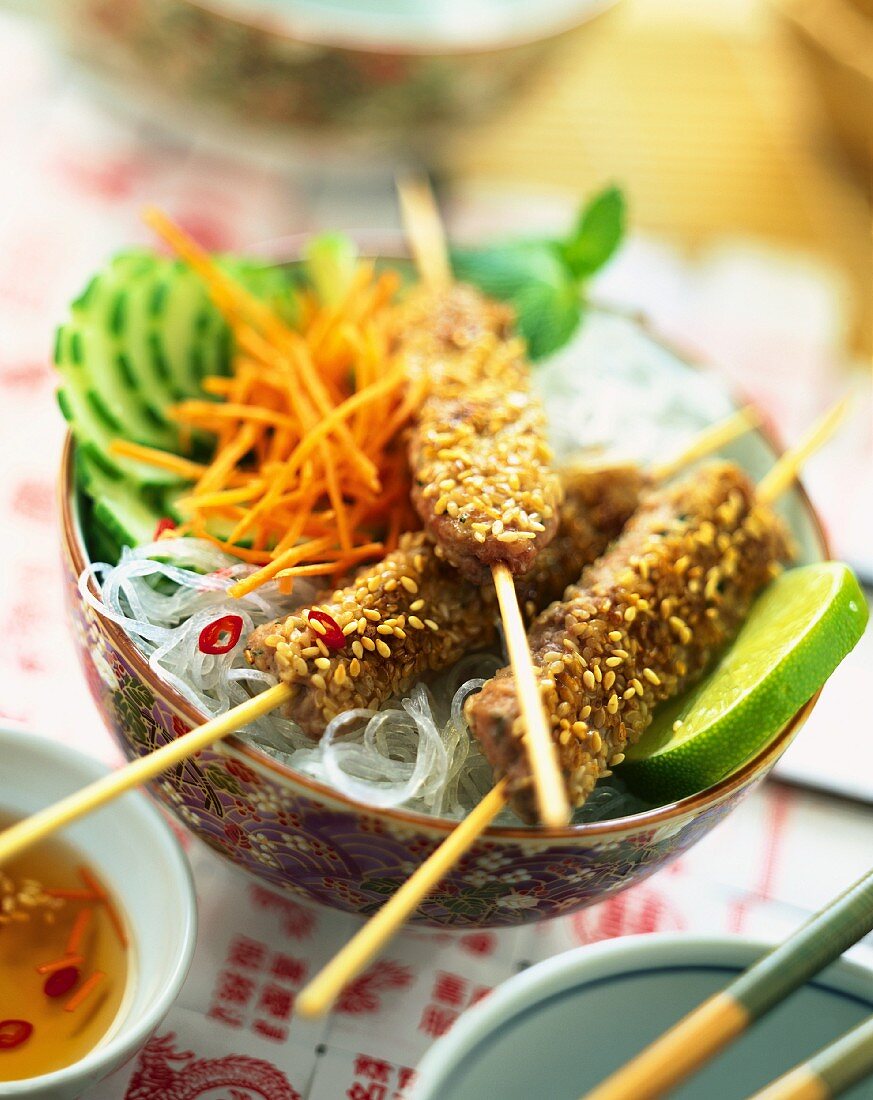 meat and sesame seed kebabs with noodles