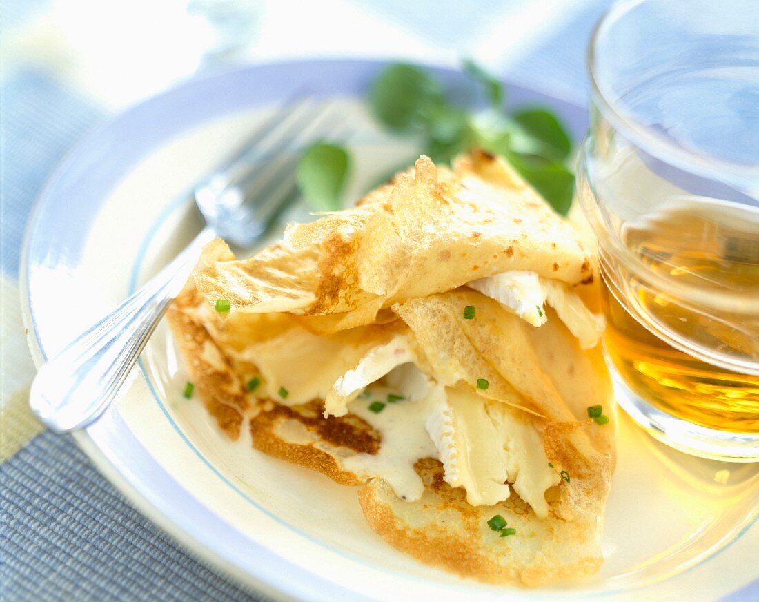 Crepe filled with Camembert and glass of Breton cider