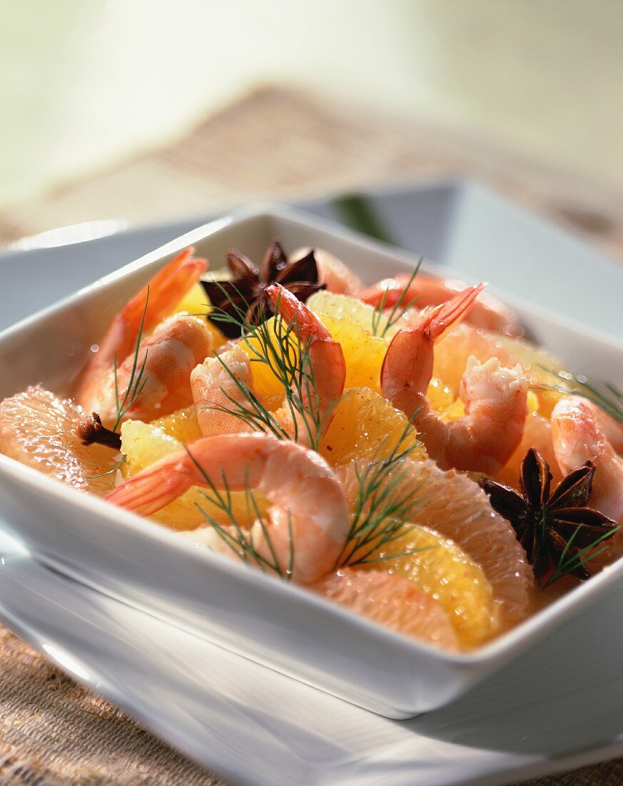 Prawns in stock with orange and grapefruit