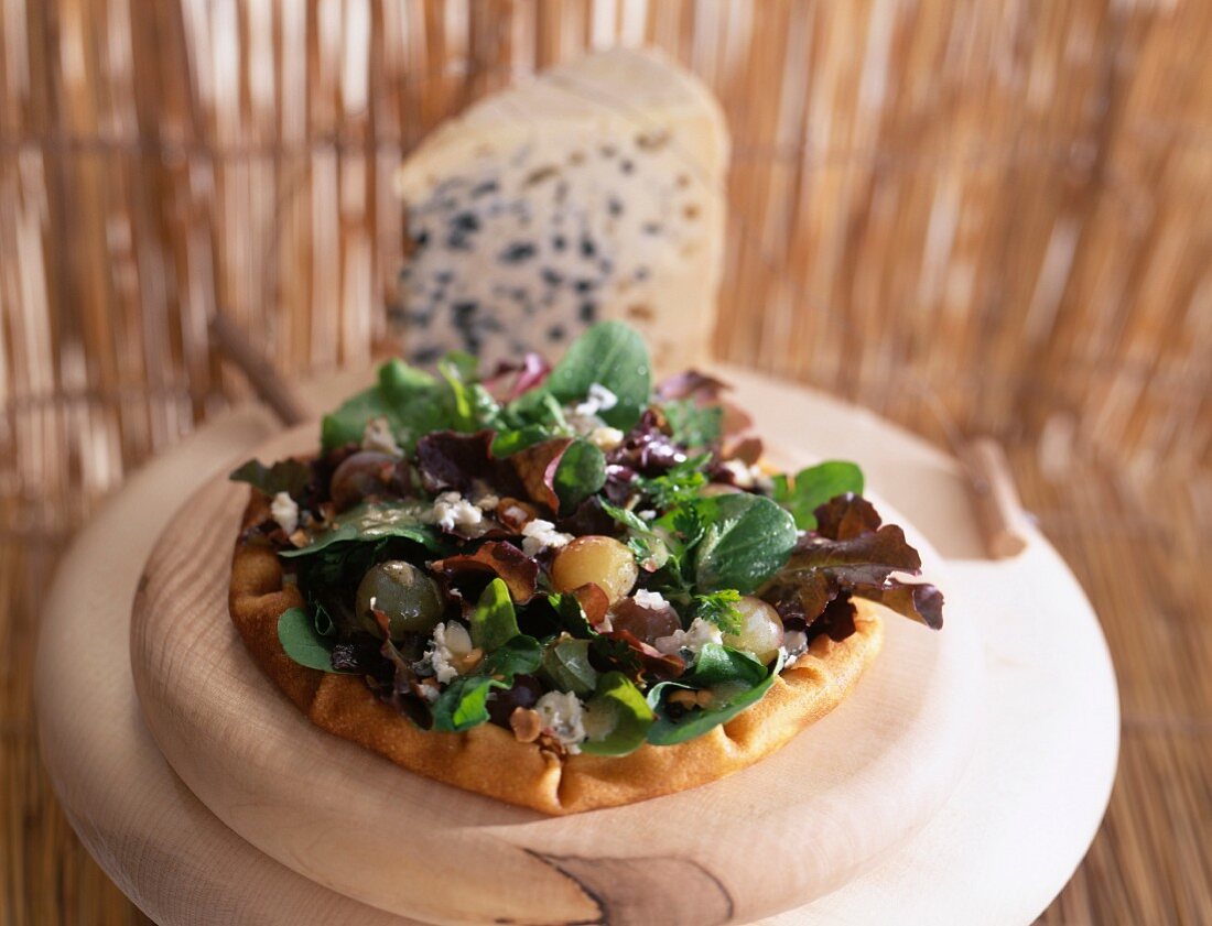 Grape picker's pancake made with mixed lettuce, roquefort, walnut and grape salad