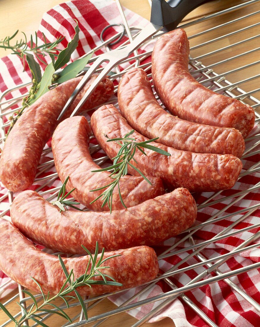 Uncooked Toulouse sausages on rack