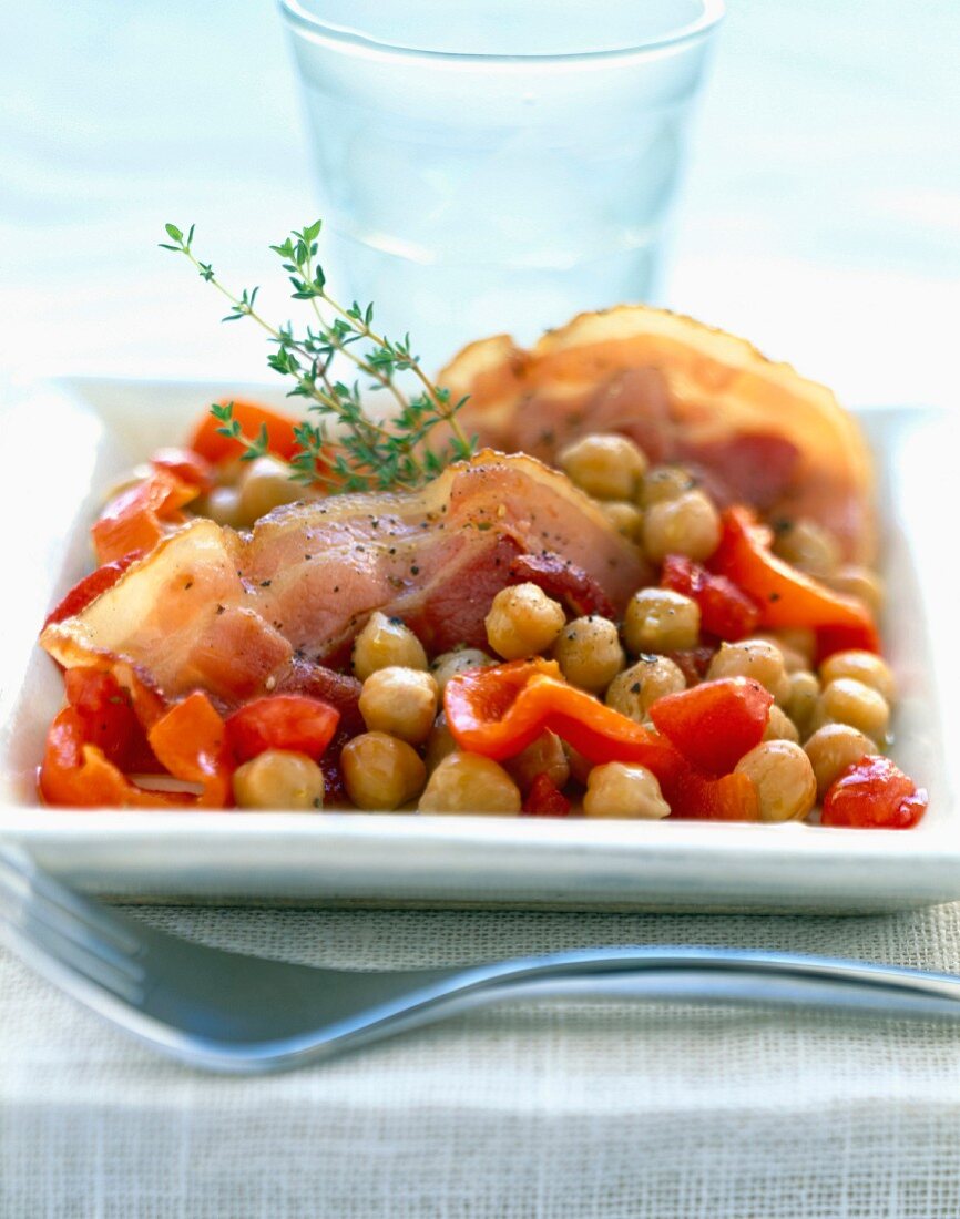 Salt pork bacon with chickpeas and red peppers