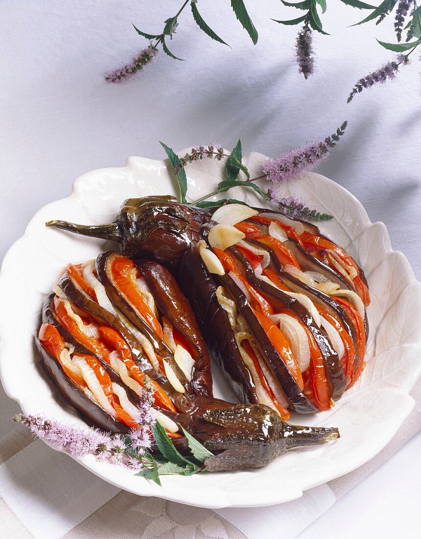 Sliced eggplants with tomatoes and onions