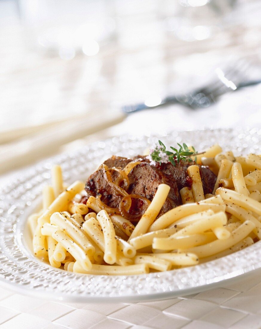 Macaroni with stewed beef and onions