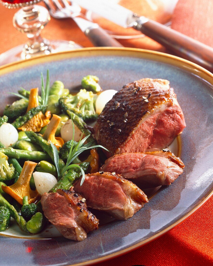 Duck breast with vegetables and chanterelles
