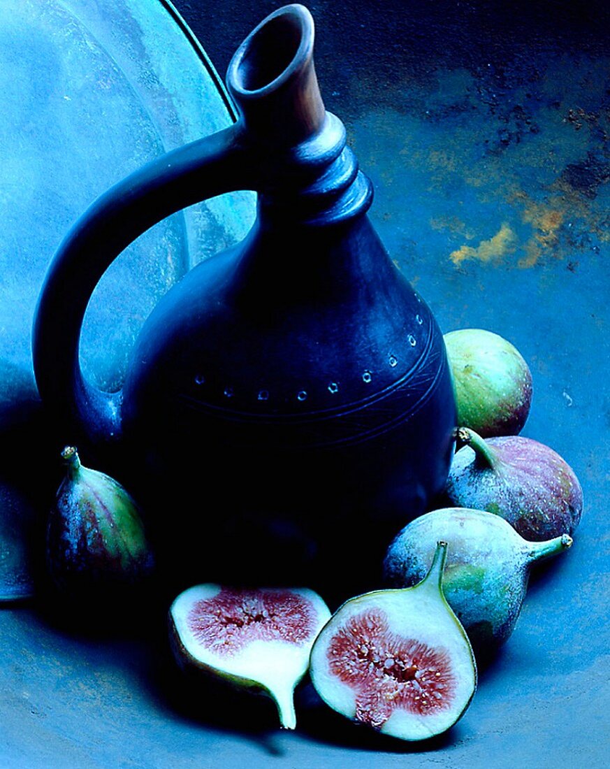 A traditional jug and fresh figs