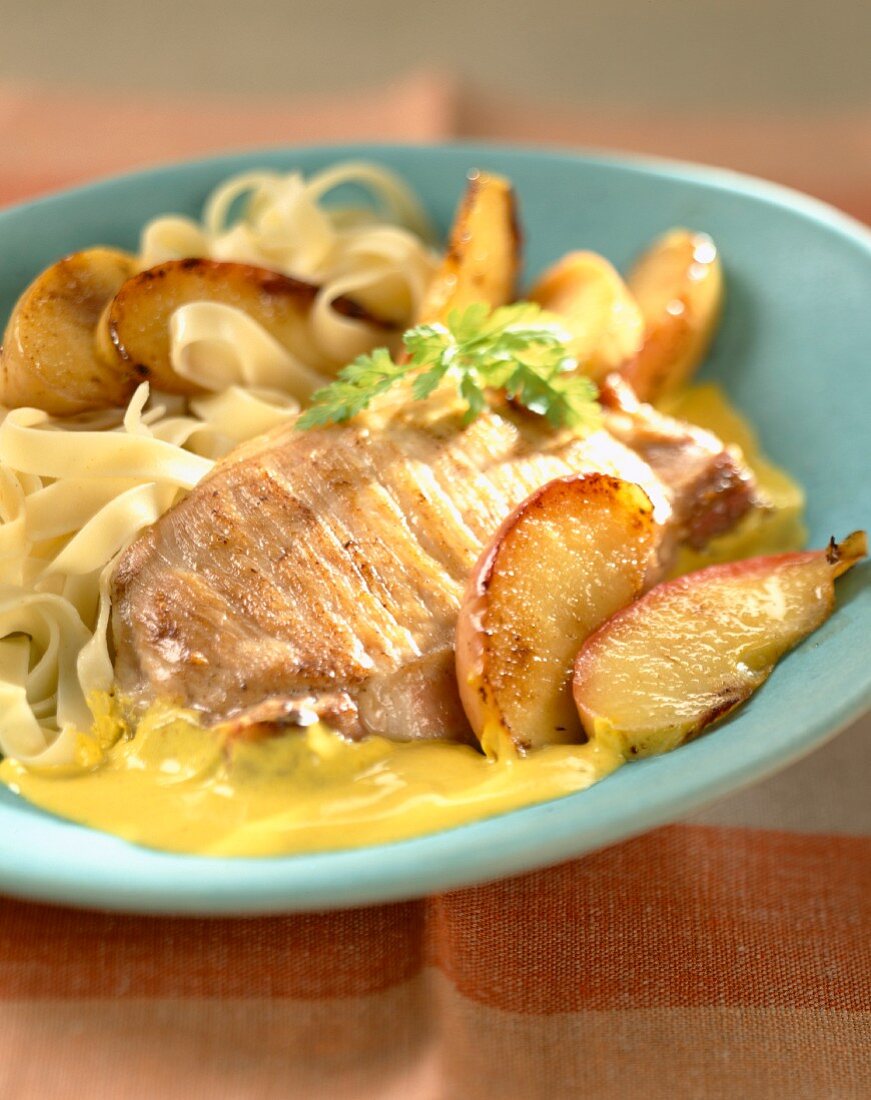 Pork chop with apples,tagliatelles and curry sauce