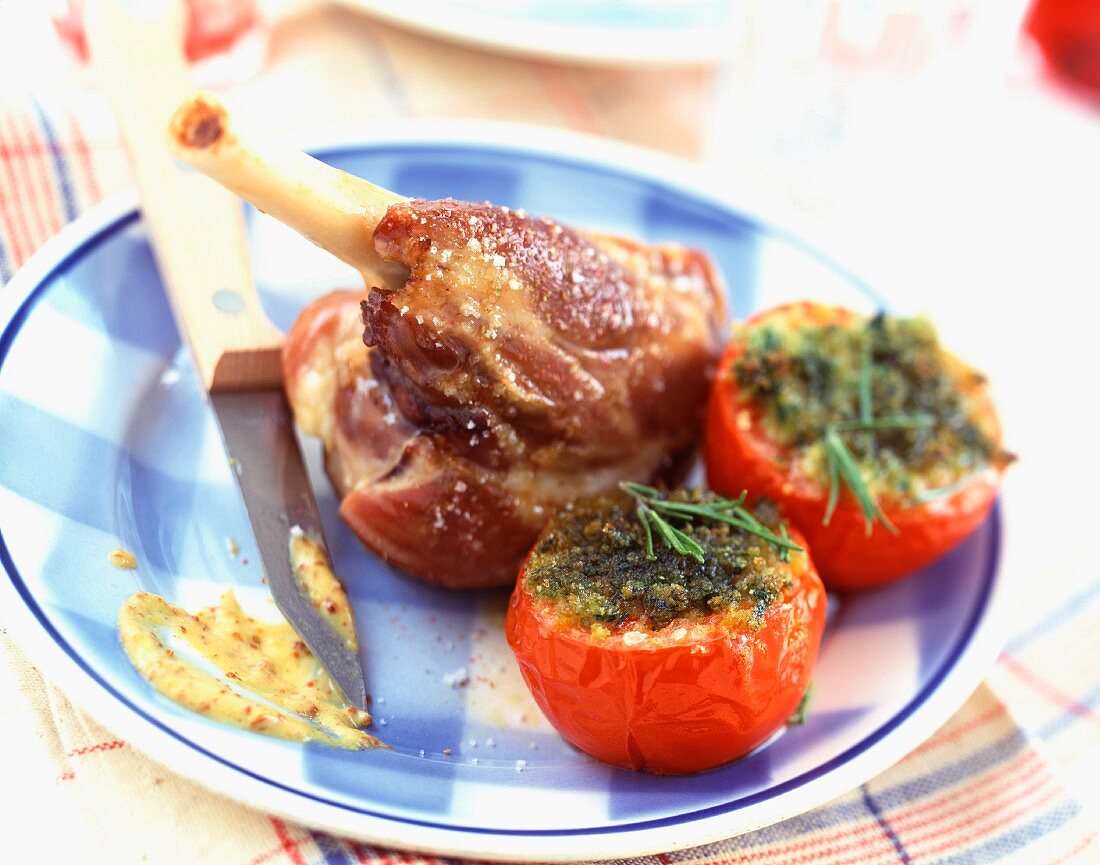 Knuckle joint of lamb with Provençal baked tomatoes