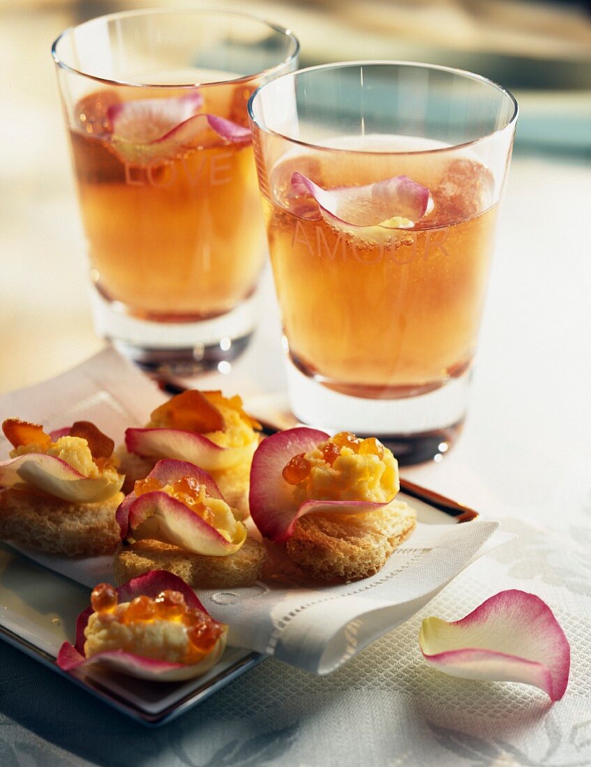 Champagne cocktail with liqueur and roses