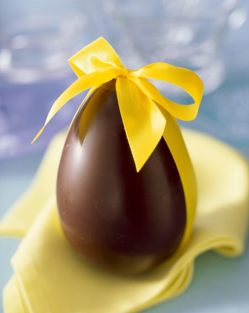 Chocolate Easter egg with yellow ribbon