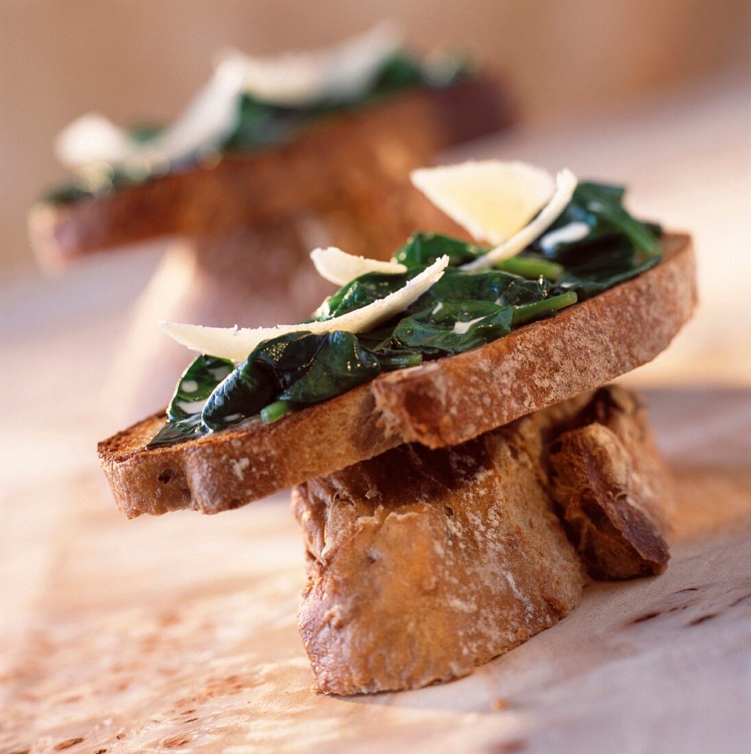 Spinach sprouts and parmesan on toast