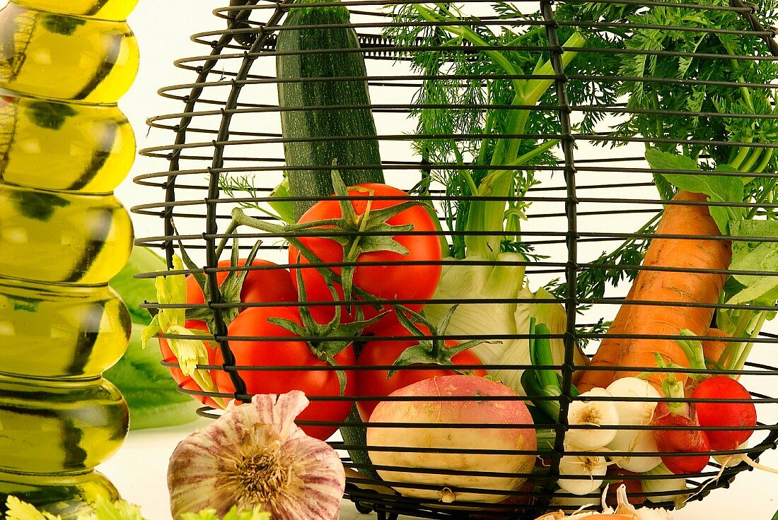 Basket of vegetables and fruit. Carrots, cabbage, lettuce, lemons, apples, courgettes