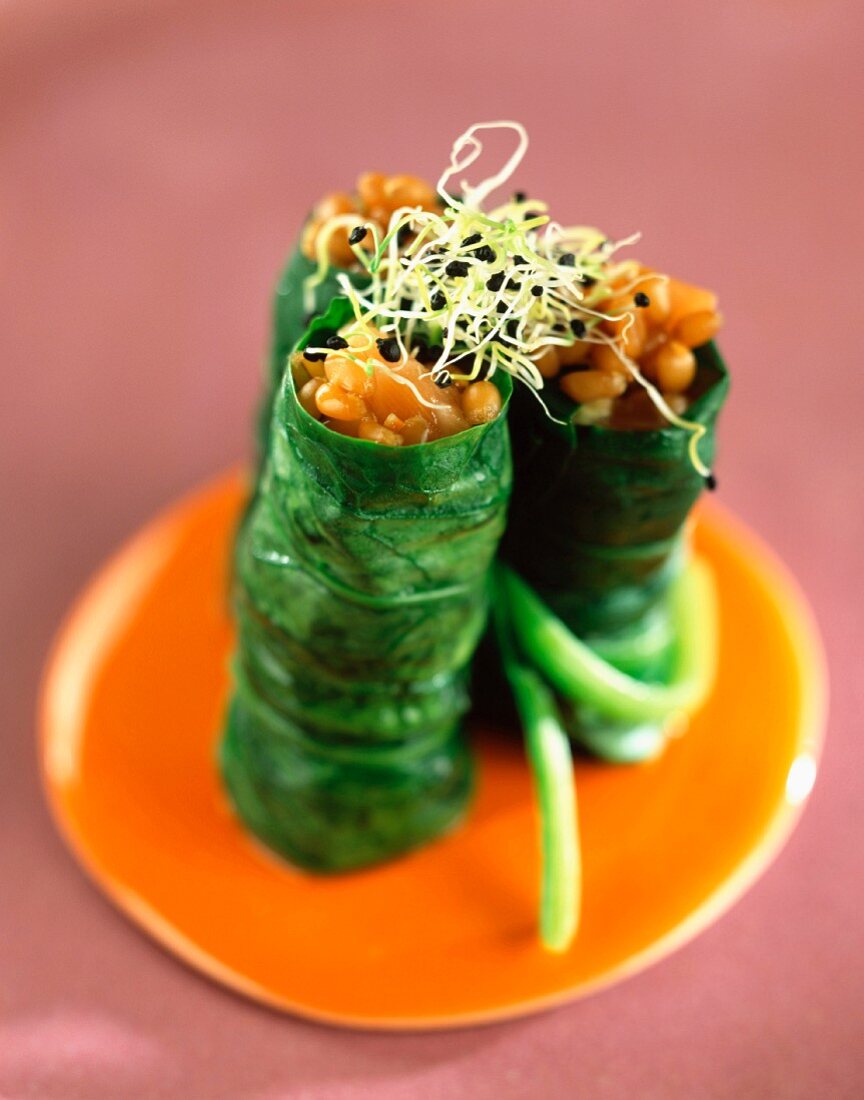 Spinach leaf sushi with salmon and wheat
