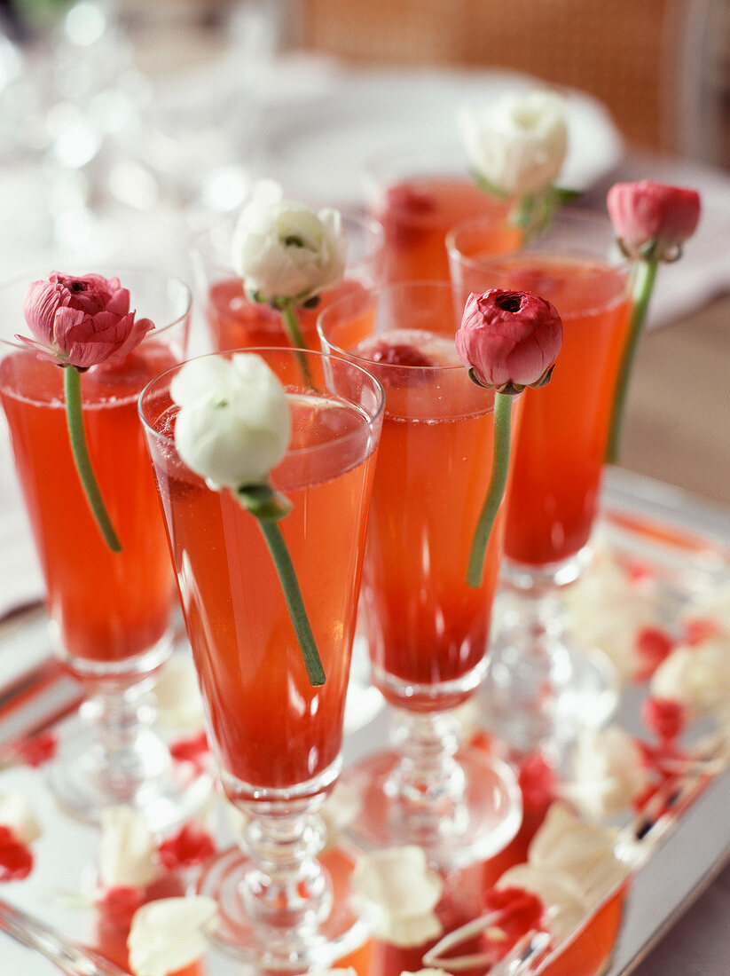 Glasses of champagne with raspberry sauce