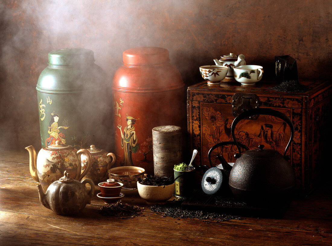 Composition of Chinese teapots with smoke, herbs and tea