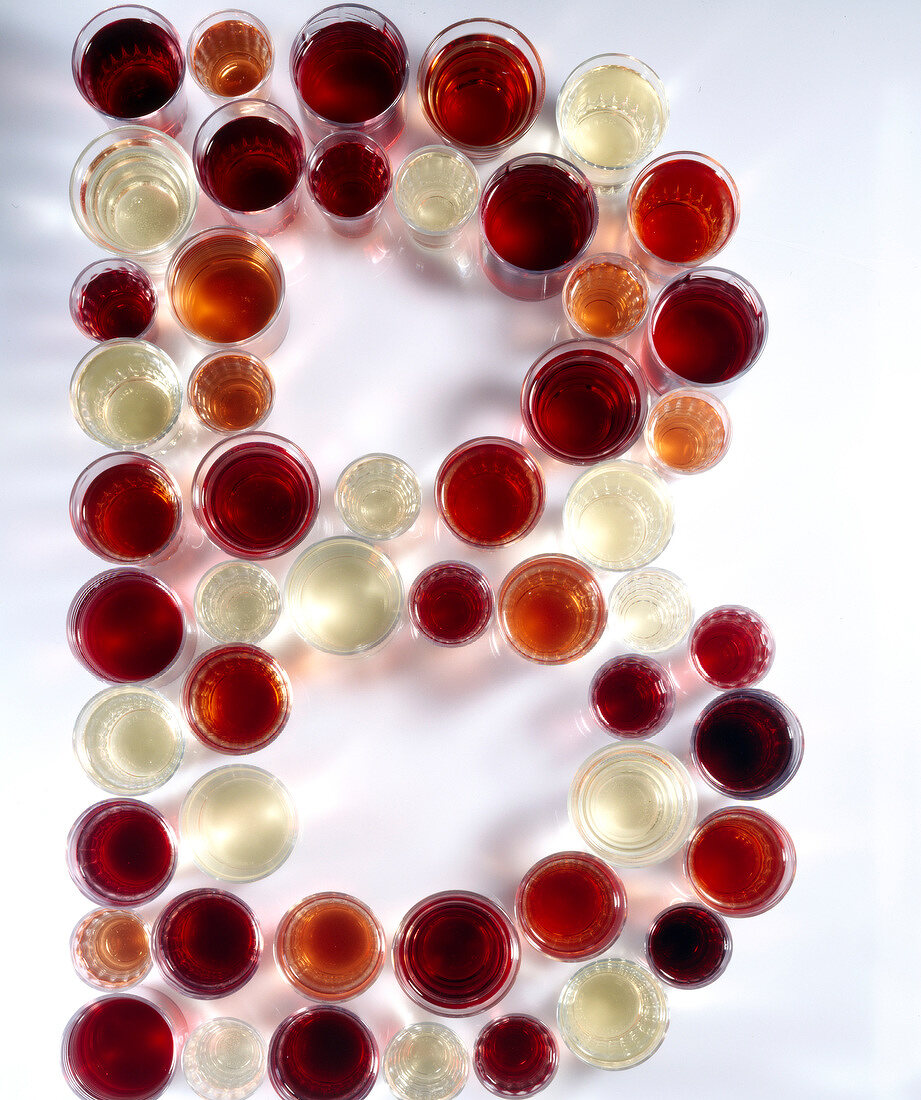 Glasses of red and white wine arranged in letter B shape