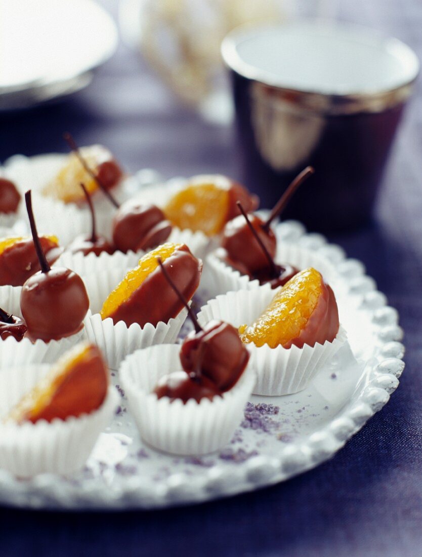 Cherries and clementines dipped in milk chocolate