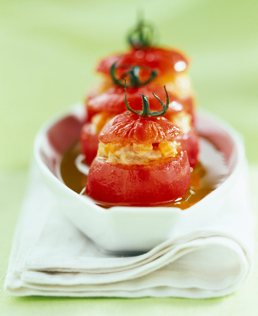 Mini tomatoes baked and stuffed with tuna
