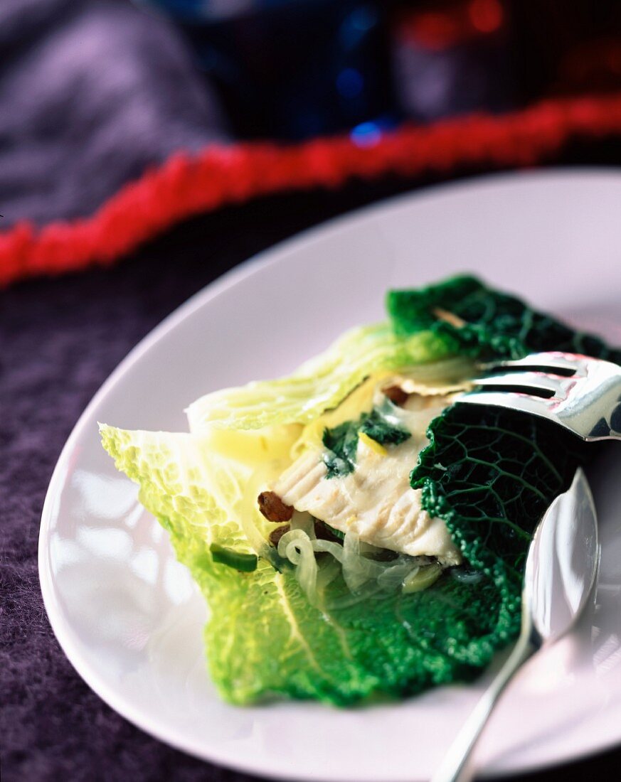 Spicy turbot fillet cooked in cabbage leaves