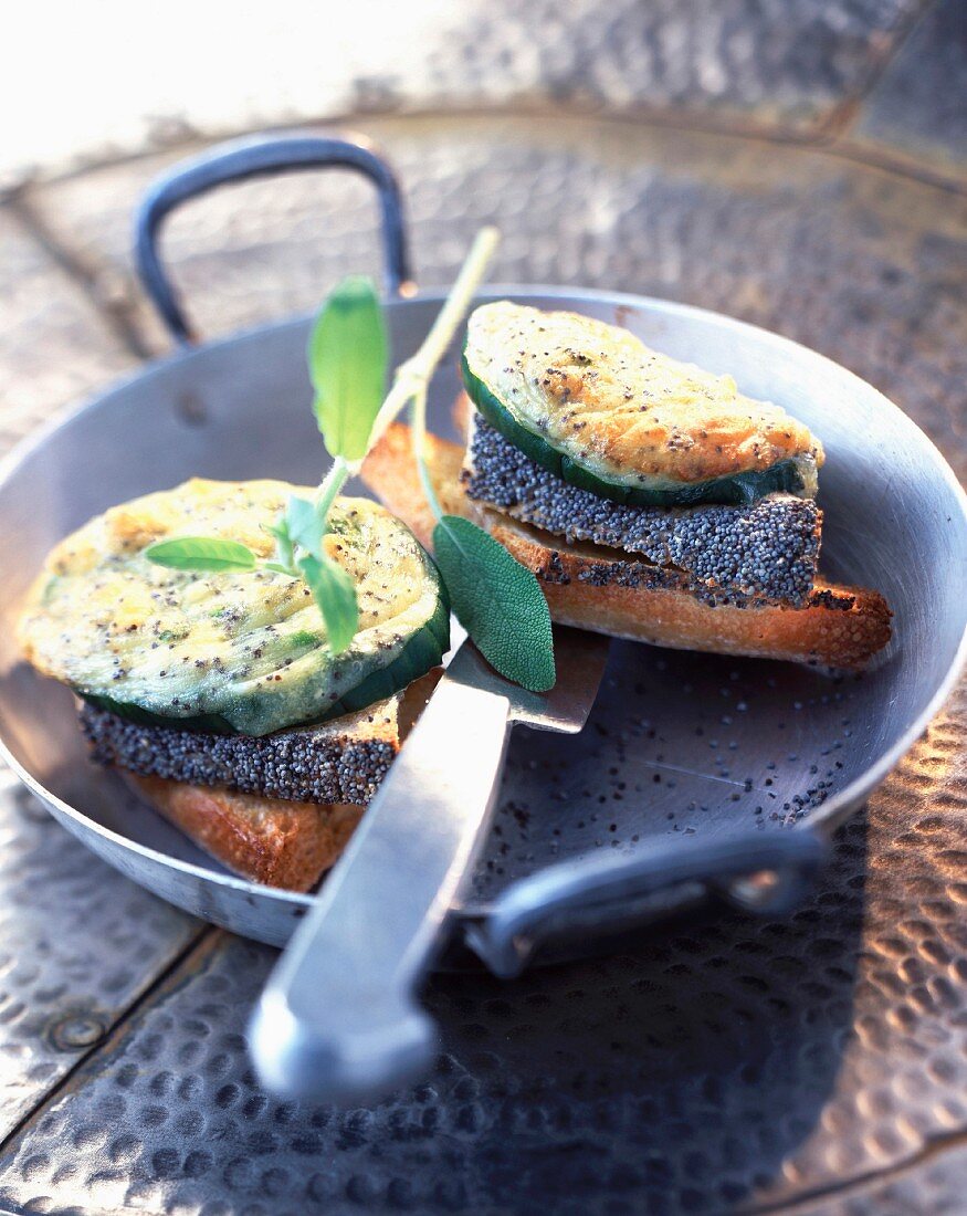 Grilled cucumber with goat's cheese and poppy seeds