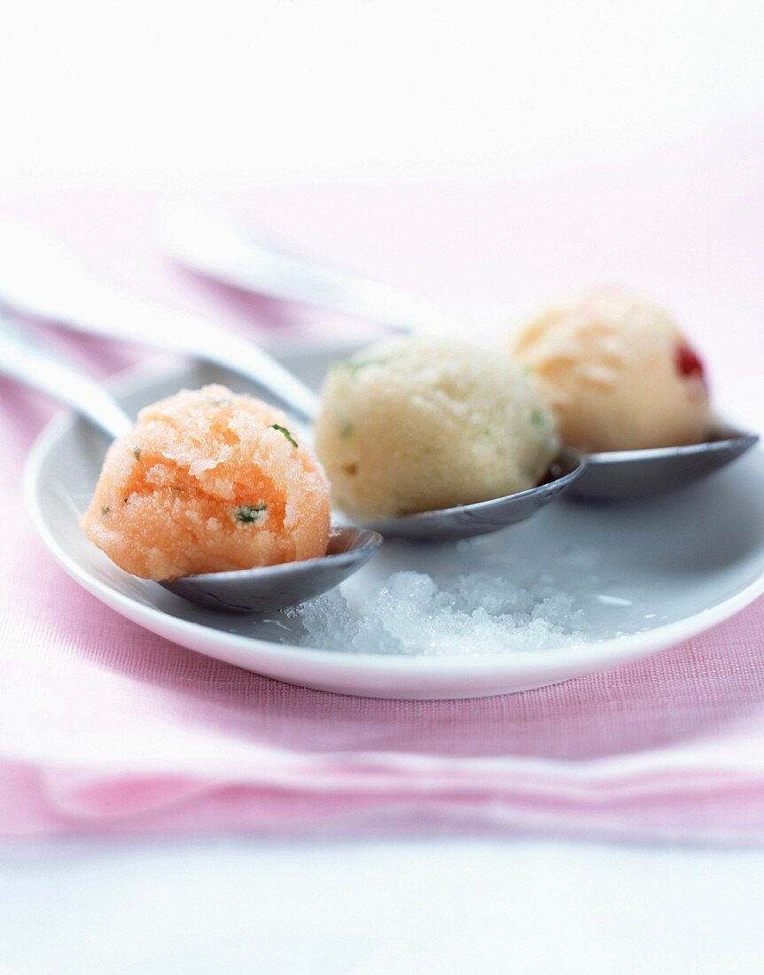 Melon, apple and nectarine sorbet on spoons