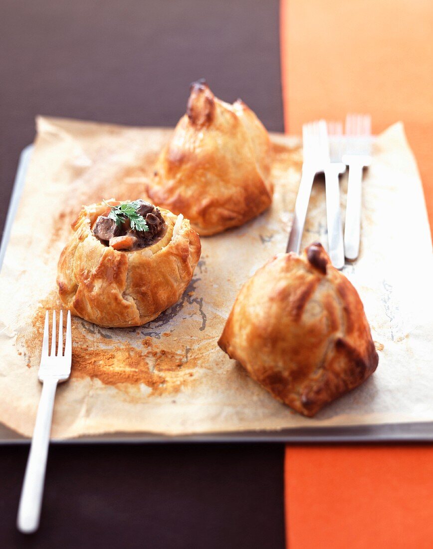 Apples stuffed with duck and blueberries wrapped in puff pastry