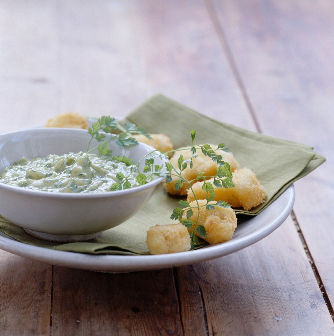 Monkfish fritters with herb sauce