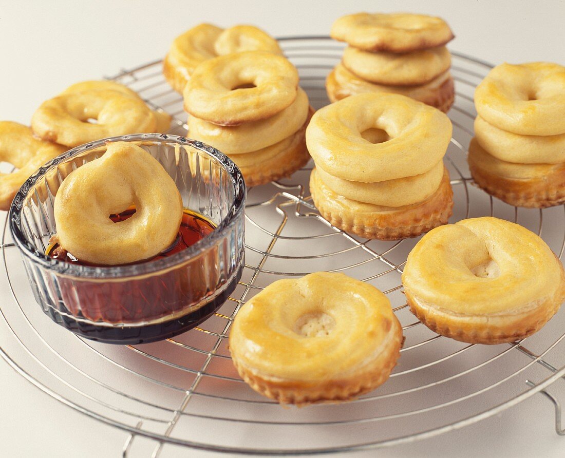 Dipping the choux crowns in the caramel