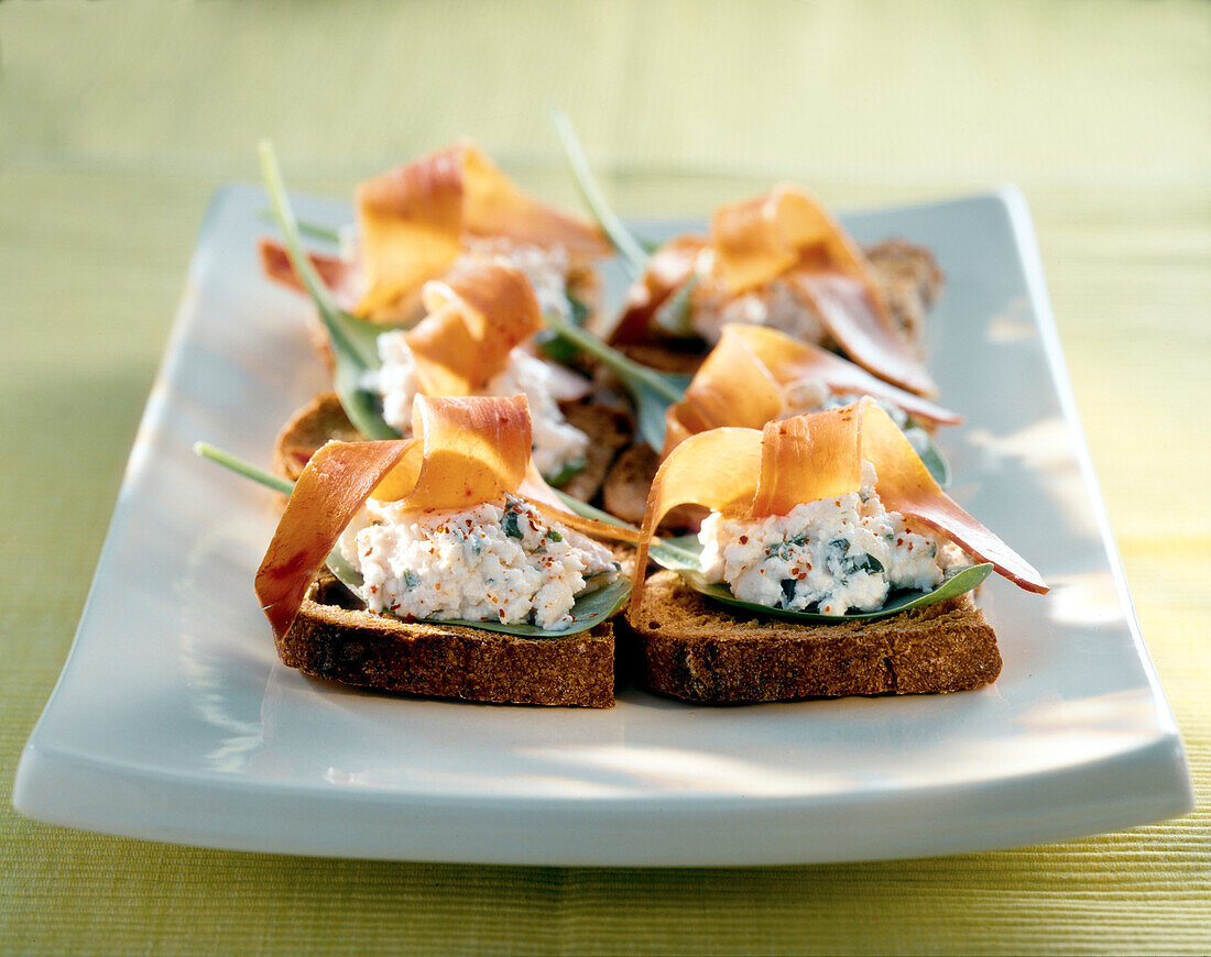 Fromage frais and bayonne ham crostinis