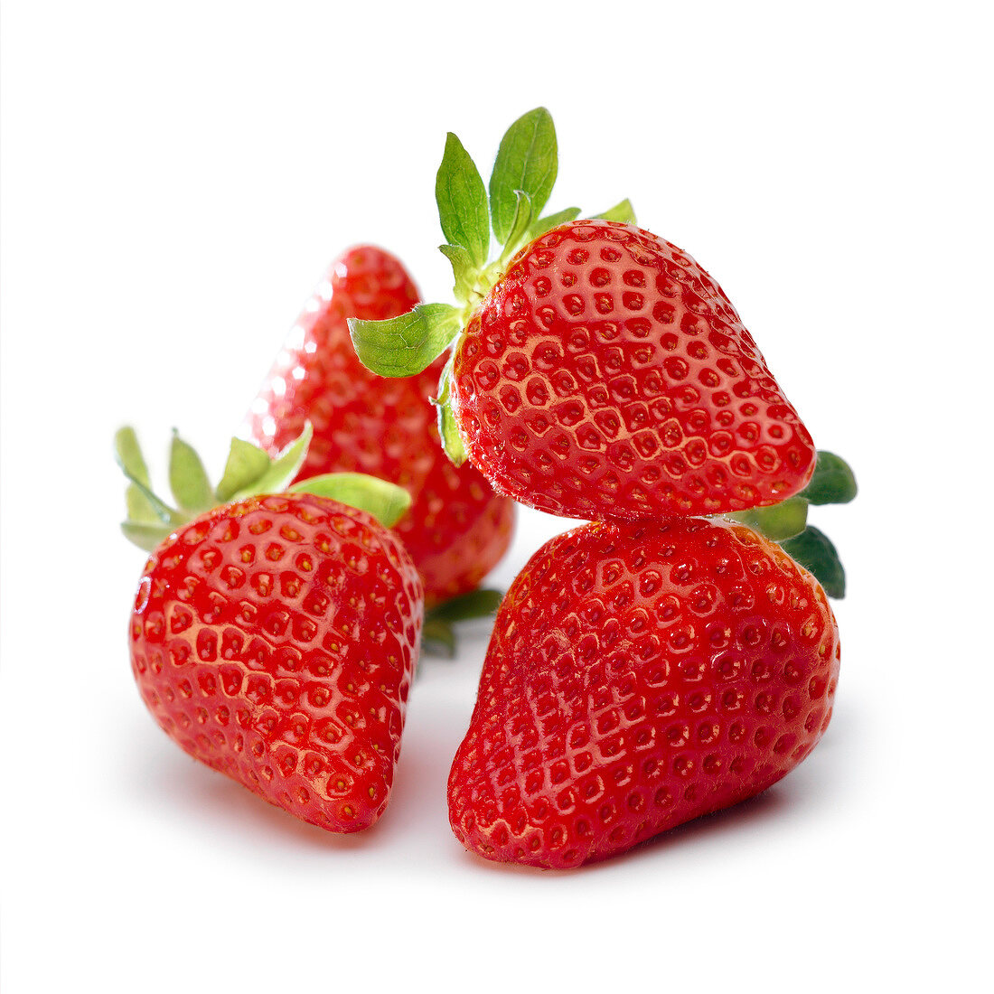 Vier frische Erdbeeren