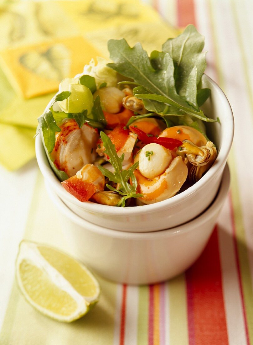 Pan-fried seafood with lemon and rocket