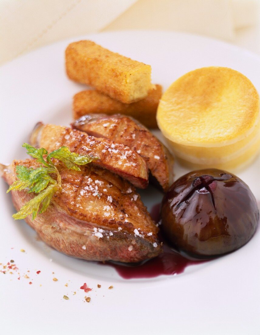 Duck fillets with fig ,polenta and potato croquette