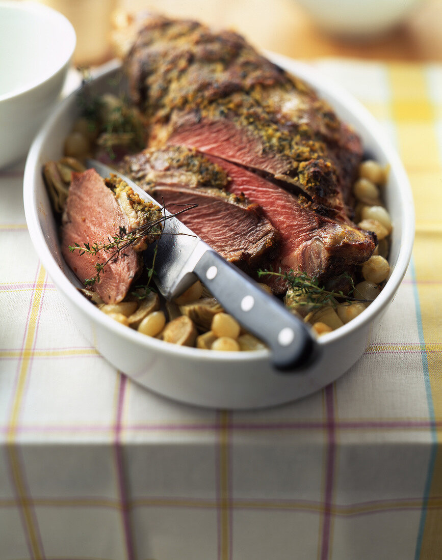 Leg of lamb with mustard and thyme crust and confit vegetables