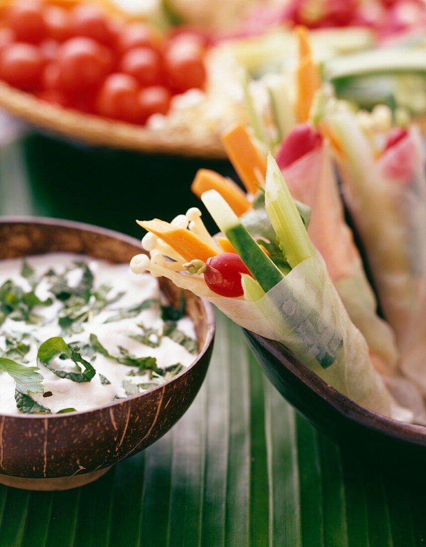 Rice cake and raw vegetable wraps with herb cream dip