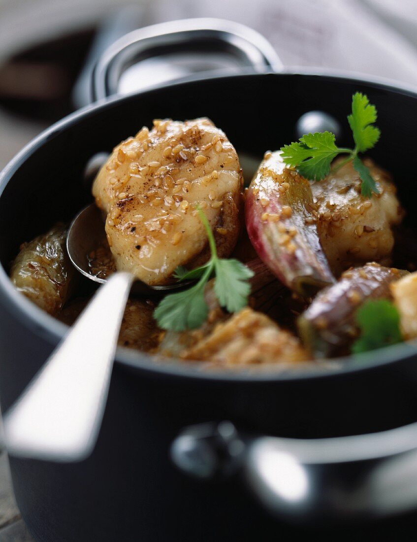 Monkfish glazed with onions and sesame seeds