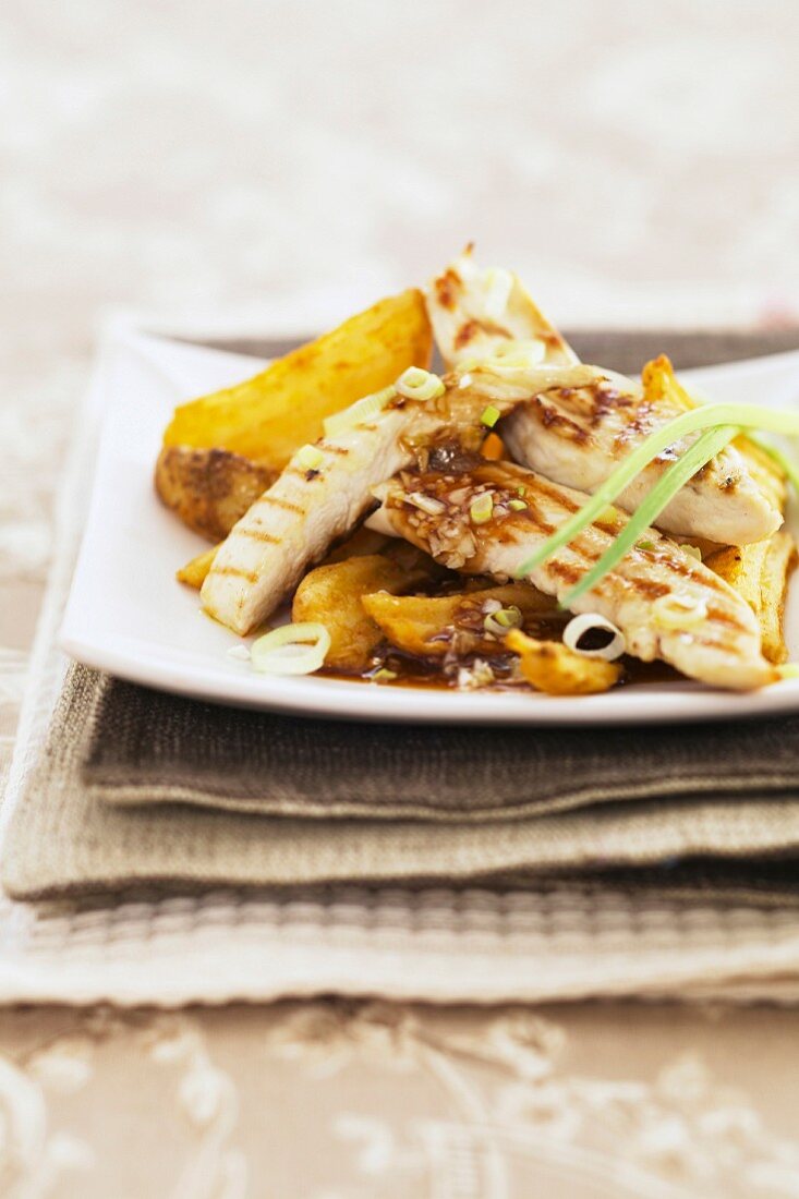 Chicken fillets with barbecue sauce and potatoes