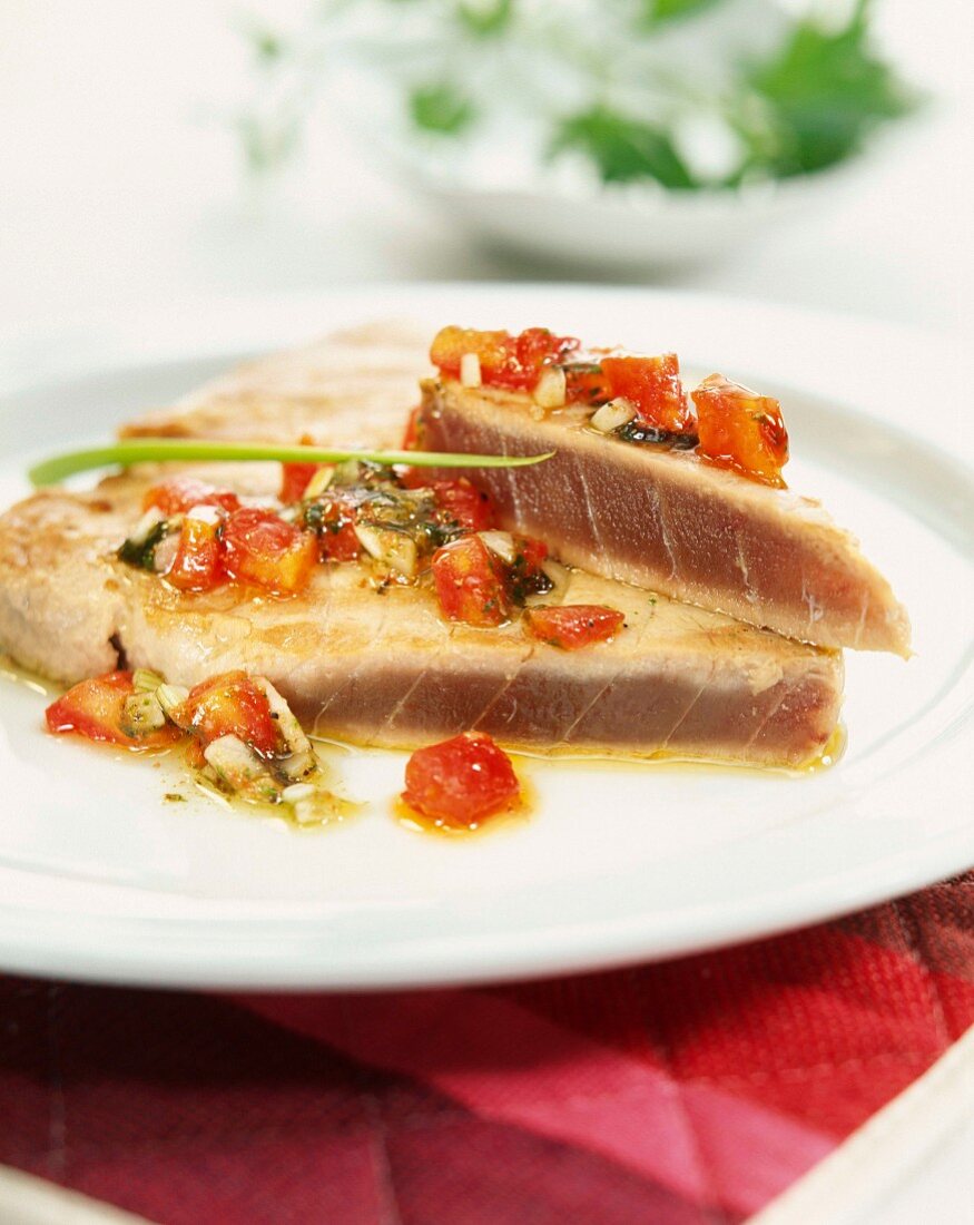 Tuna fillets cooked in the oven with tomatoes