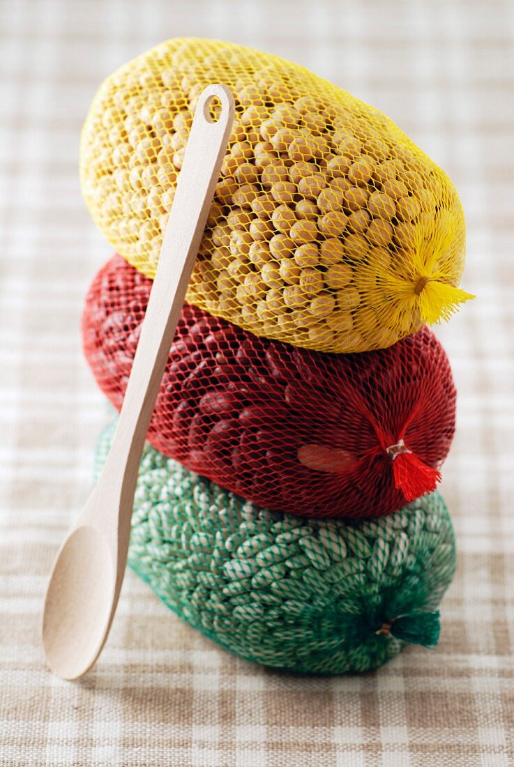 Three string bags of dried vegetables