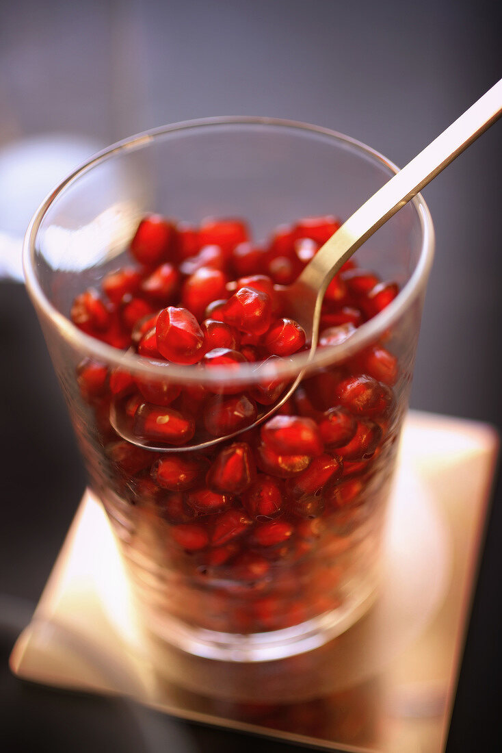 Glass of pomegranate seeds
