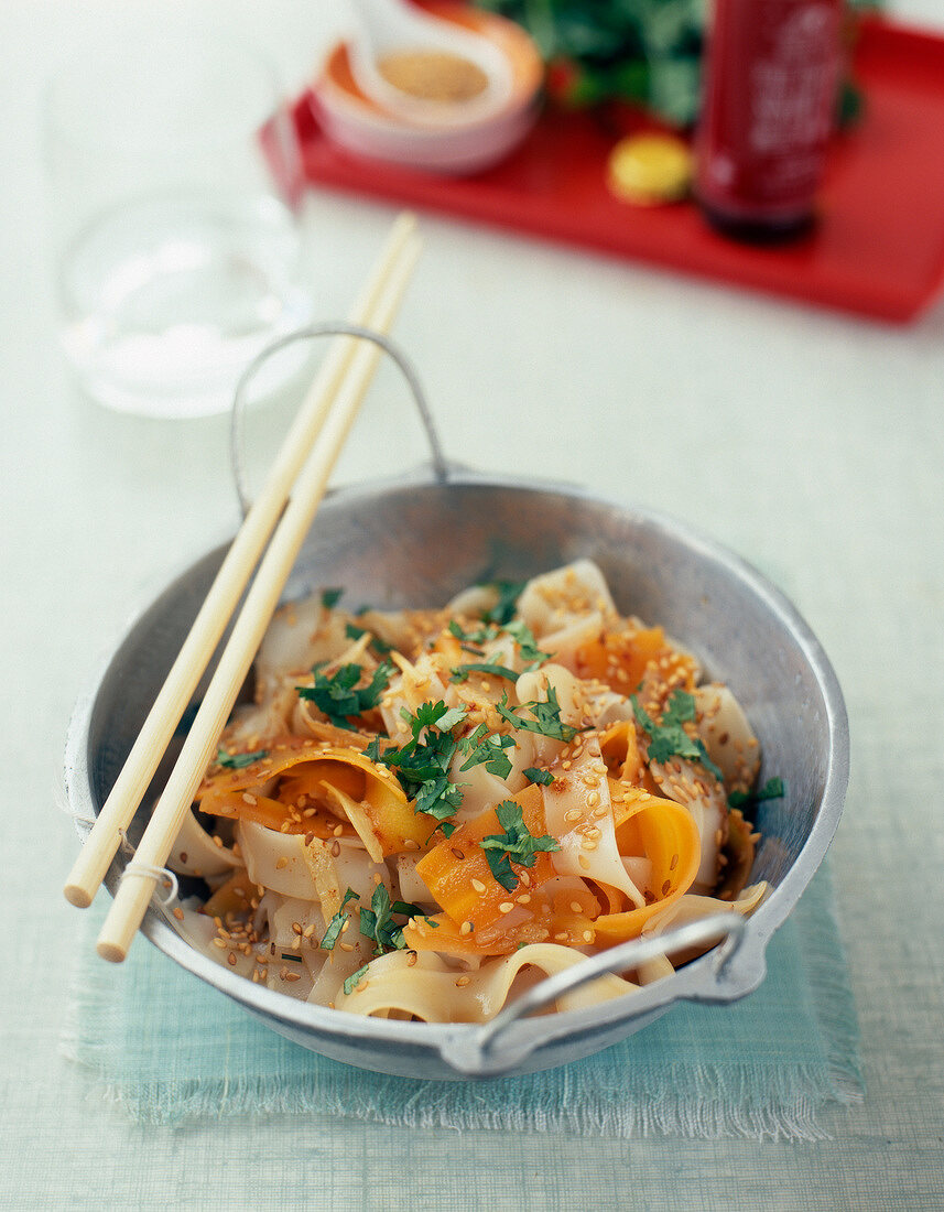 Fried noodles with carrots,sesame seeds and vinegar