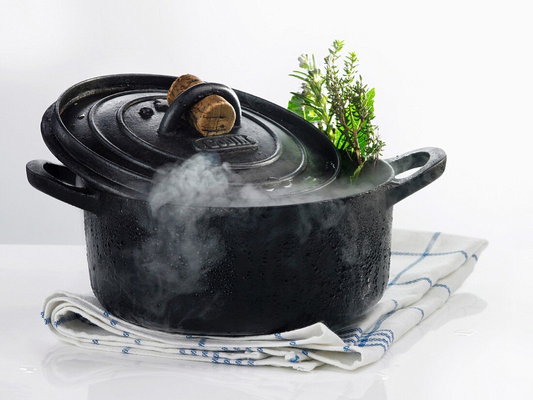 Cast iron casserole dish with steam