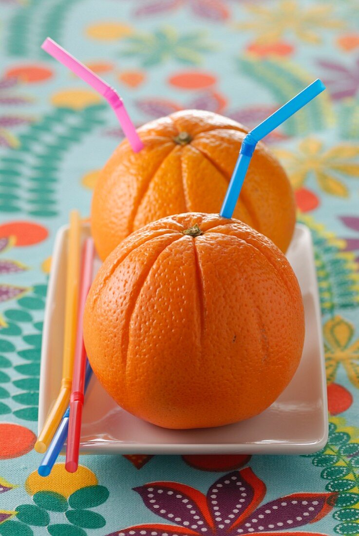 Oranges with straw