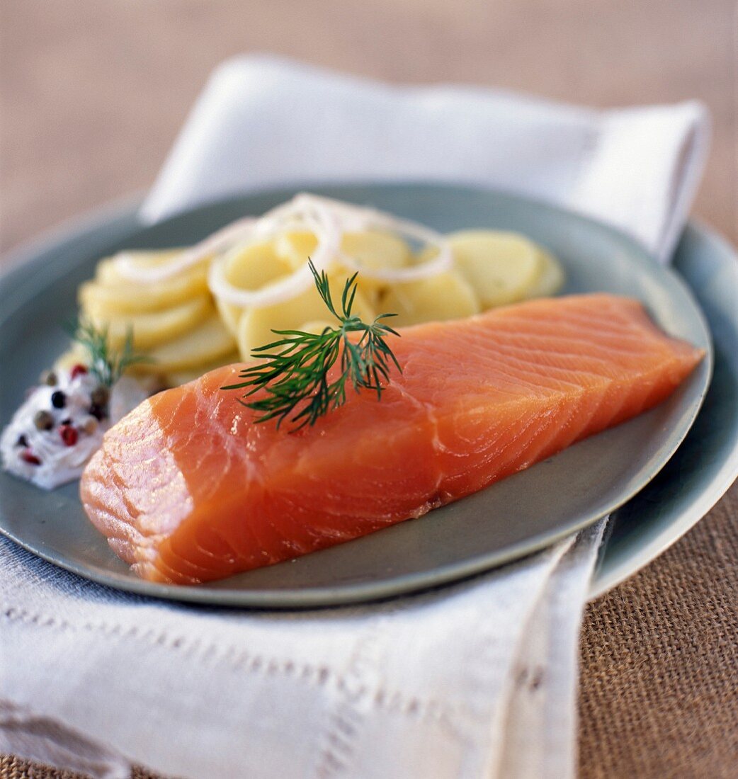 Thick piece of smoked salmon with potatoes
