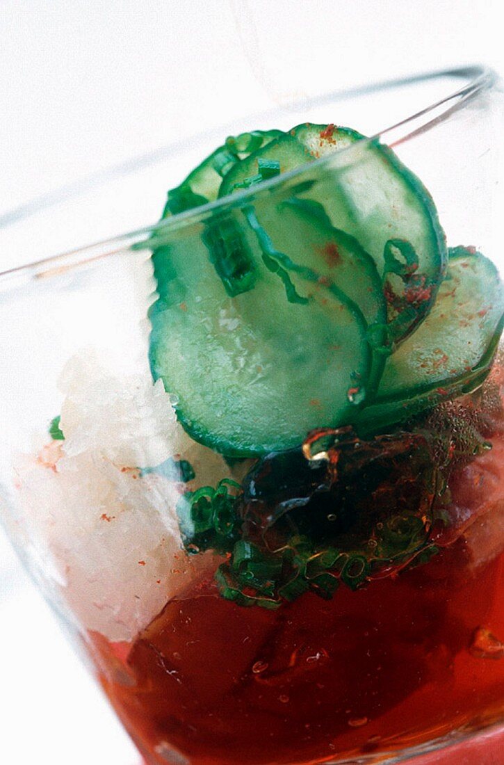 An ice cold vegetable drink with chives and cucumber