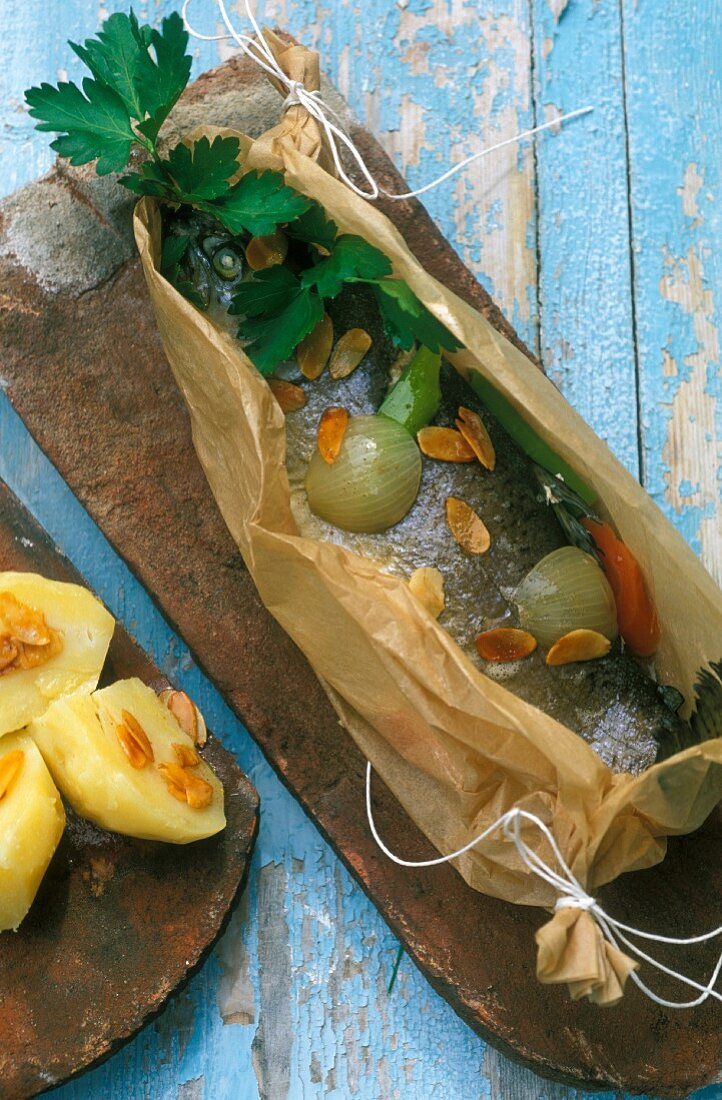 Alsatian-style trout in parchment paper with almonds, onions and parsley