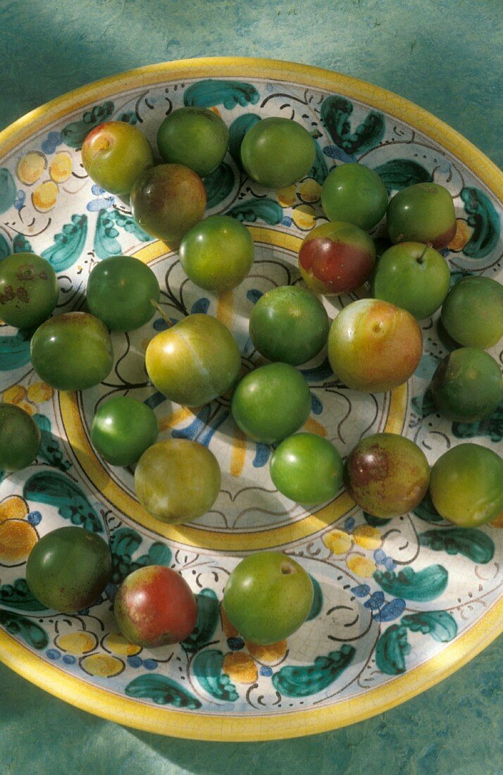 Greengages on a Mediterranean ceramic plate