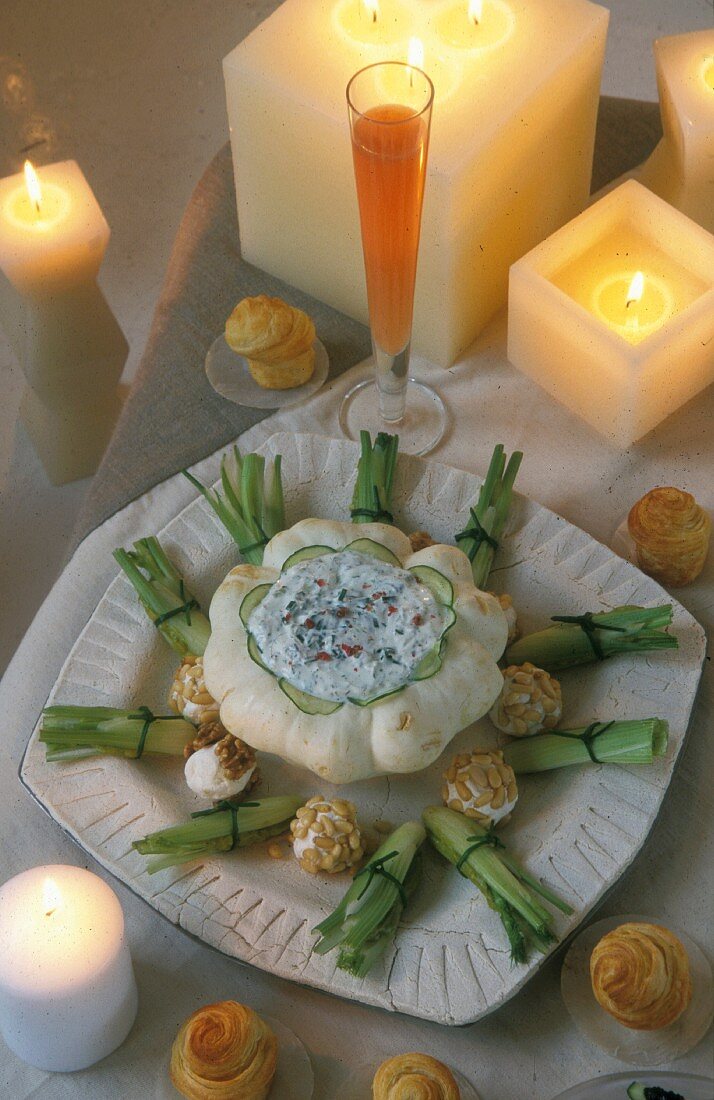 Pumpkin filled with cervelle de canut cream cheese on a table laid for Christmas dinner