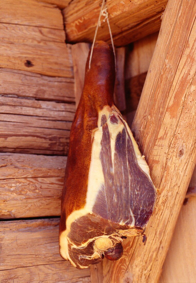Ham drying on a wooden beam